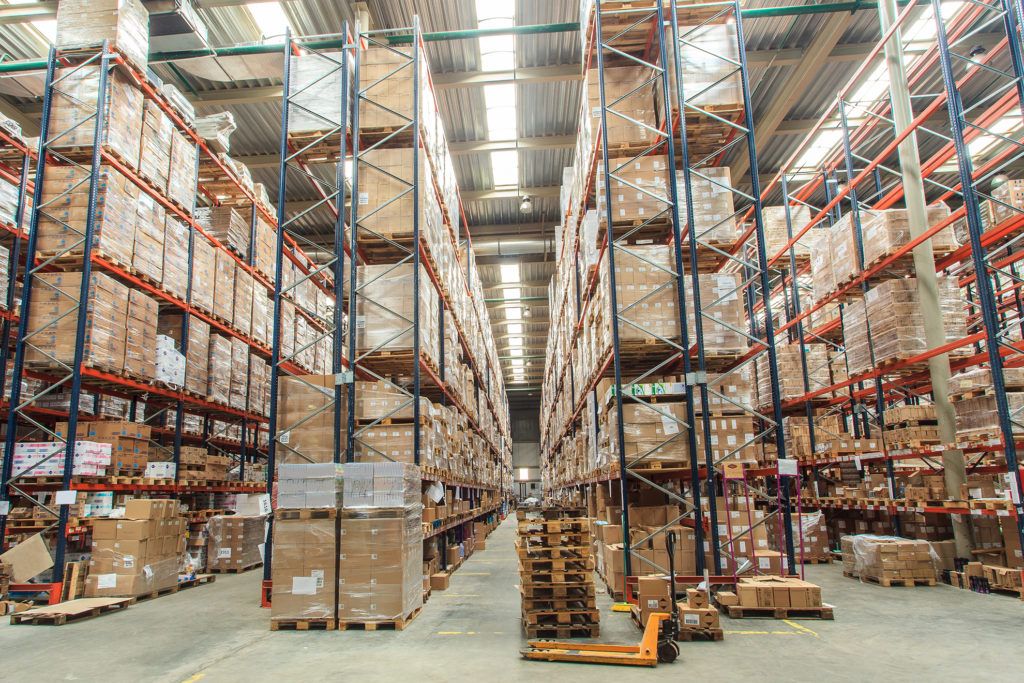 warehouse shelves stocked with boxes