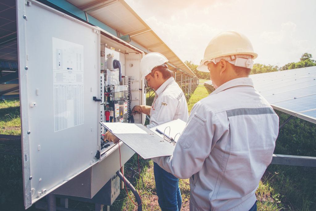 Technicians working with solar panels