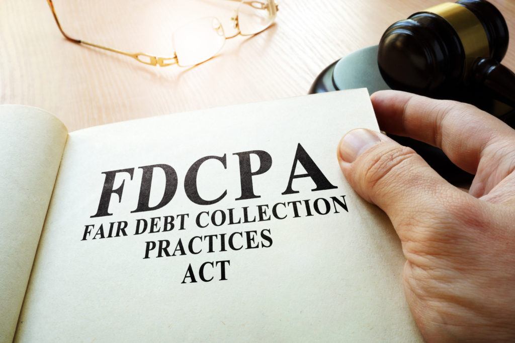 Fair Debt Collection Practices Act FDCPA on a table